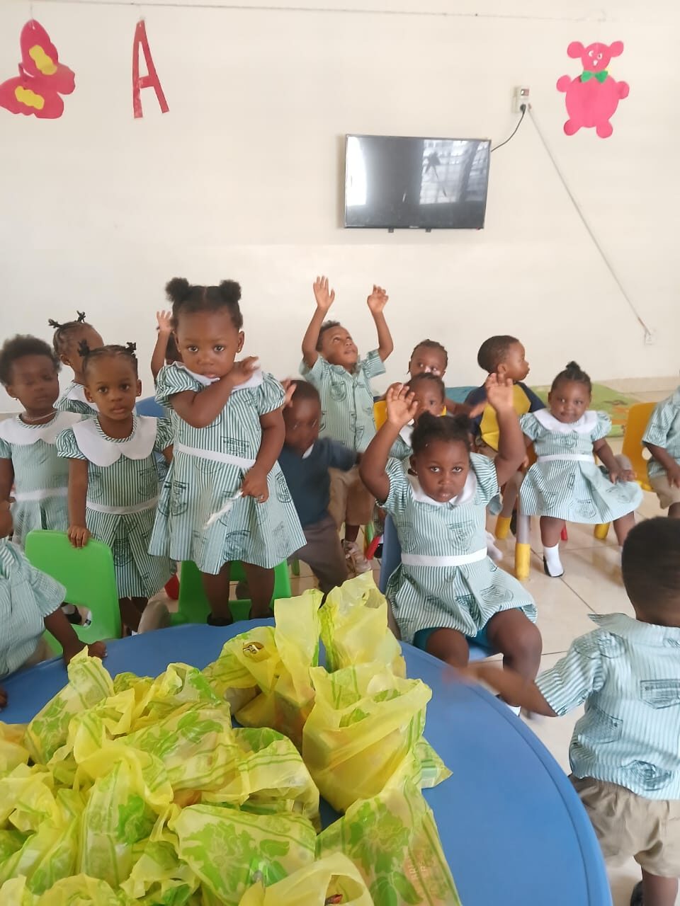 Pupils cheering in their classroom