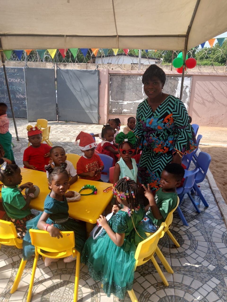 Head teacher with pupils at a school event